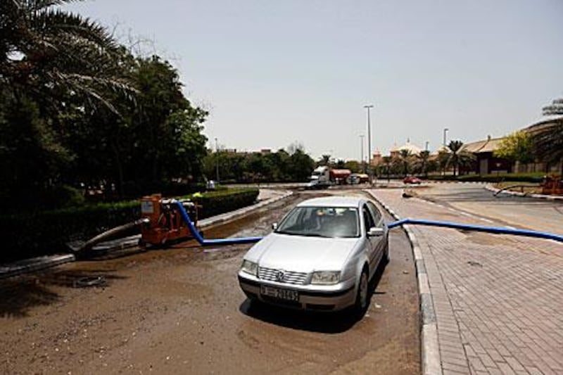 Pumping operations cleared most of the water in the area near Ibn Battuta Mall, Dubai, but traffic disruptions remained yesterday. Satish Kumar / The National