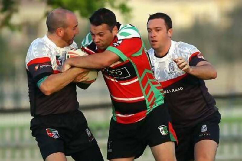 Mana Dubai, in white, will meet the Abu Dhabi Harlequins, in red and green, at the Al Ain Amblers Rugby Club in the final of the Rugby League Cup.