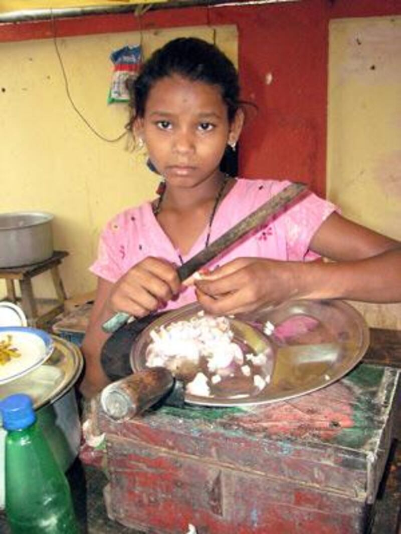 Chunmun Kumari, 13 helps her mother and siblings at the eatery for 10-12 hours a day to earn a livelihood.