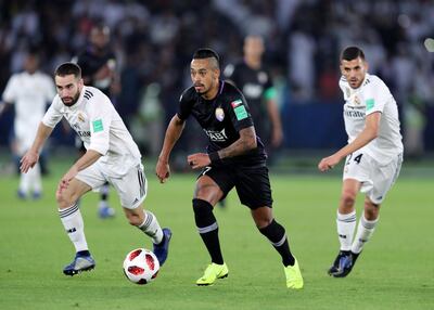 Abu Dhabi, United Arab Emirates - December 22, 2018: Dani Ceballos (R) and Dani Carvajal of Real Madrid competes with Caio of Al Ain during the match between Real Madrid and Al Ain at the Fifa Club World Cup final. Saturday the 22nd of December 2018 at the Zayed Sports City Stadium, Abu Dhabi. Chris Whiteoak / The National