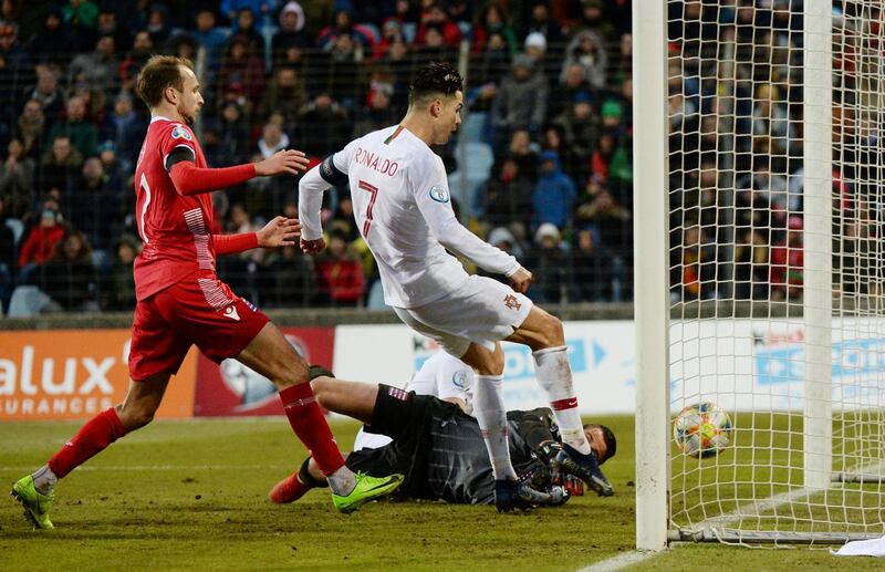 Portugal's Cristiano Ronaldo scores their second goal in a 2-0 win against Luxembourg. Reuters