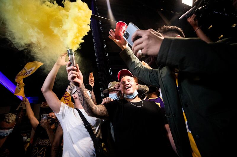 Fans celebrate victory the Staples Center in Los Angeles.  EPA