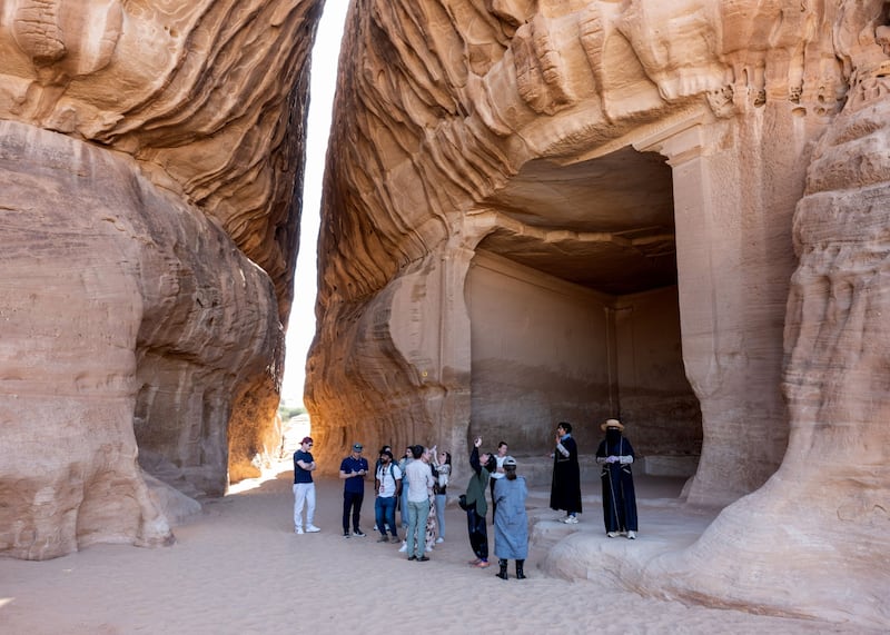 Tourists take a tour of the ancient Nabataean site of Hegra in AlUla, Saudi Arabia. Bloomberg