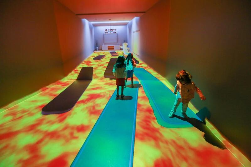 Children play in the projected rooms at the Museum of the Future Tour at the Madinat Jumeirah. Victor Besa for The National.