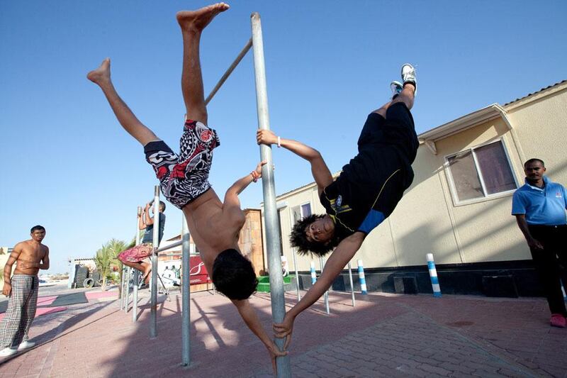 Kids pose for a picture on the Kite Beach in Umm Suqueim area of Dubai.  Jaime Puebla / The National