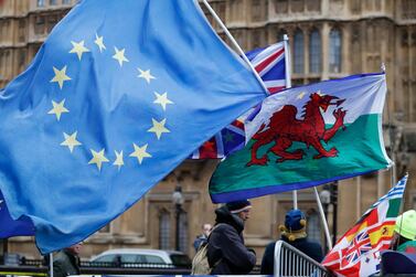 EU, British and Welsh flags near the Palace of Westminster in London. British lawmakers overwhelmingly rejected Prime Minister Theresa May's divorce deal with the European Union on Tuesday, plunging the Brexit process into chaos and triggering a no-confidence vote that could topple her government. AP 