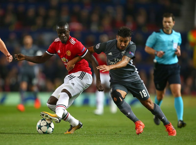 Benfica's Eduardo Salvio, right, challenges for the ball with Manchester United's Eric Bailly during the Champions League group A soccer match between Manchester United and Benfica, at Old Trafford, in Manchester, England, Tuesday, Oct. 31, 2017. (AP Photo/Dave Thompson)