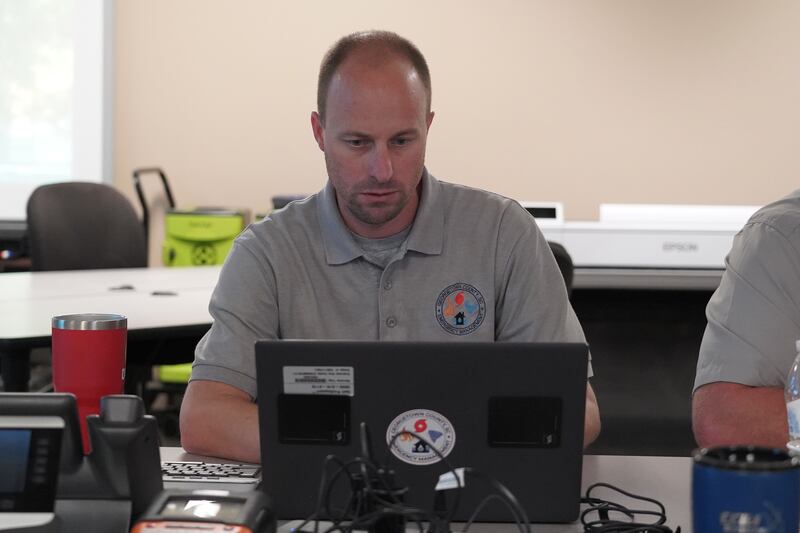 Brandon Ellis, director of Emergency Services for Georgetown County, South Carolina at his desk at the county's emergency response command centre. Willy Lowry / The National