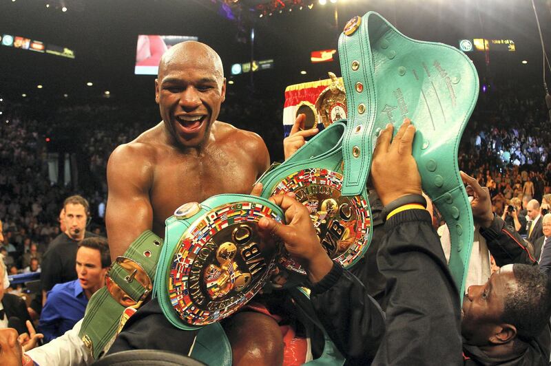 LAS VEGAS, NV - MAY 05:  Floyd Mayweather Jr. celebrates after defeating Miguel Cotto by unanimous decision during their WBA super welterweight title fight at the MGM Grand Garden Arena on May 5, 2012 in Las Vegas, Nevada.  (Photo by Al Bello/Getty Images)