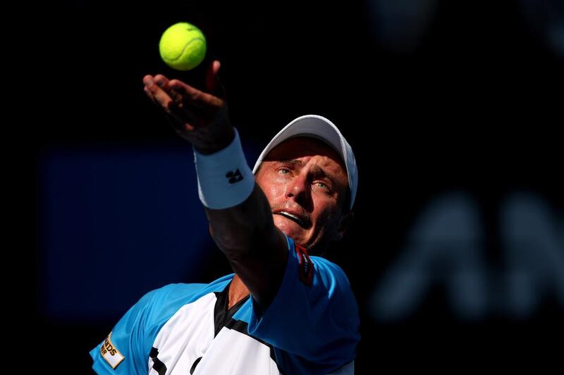 Lleyton Hewitt of Australia serves in his first round match against Andreas Seppi of Italy. Clive Brunskill / Getty Images