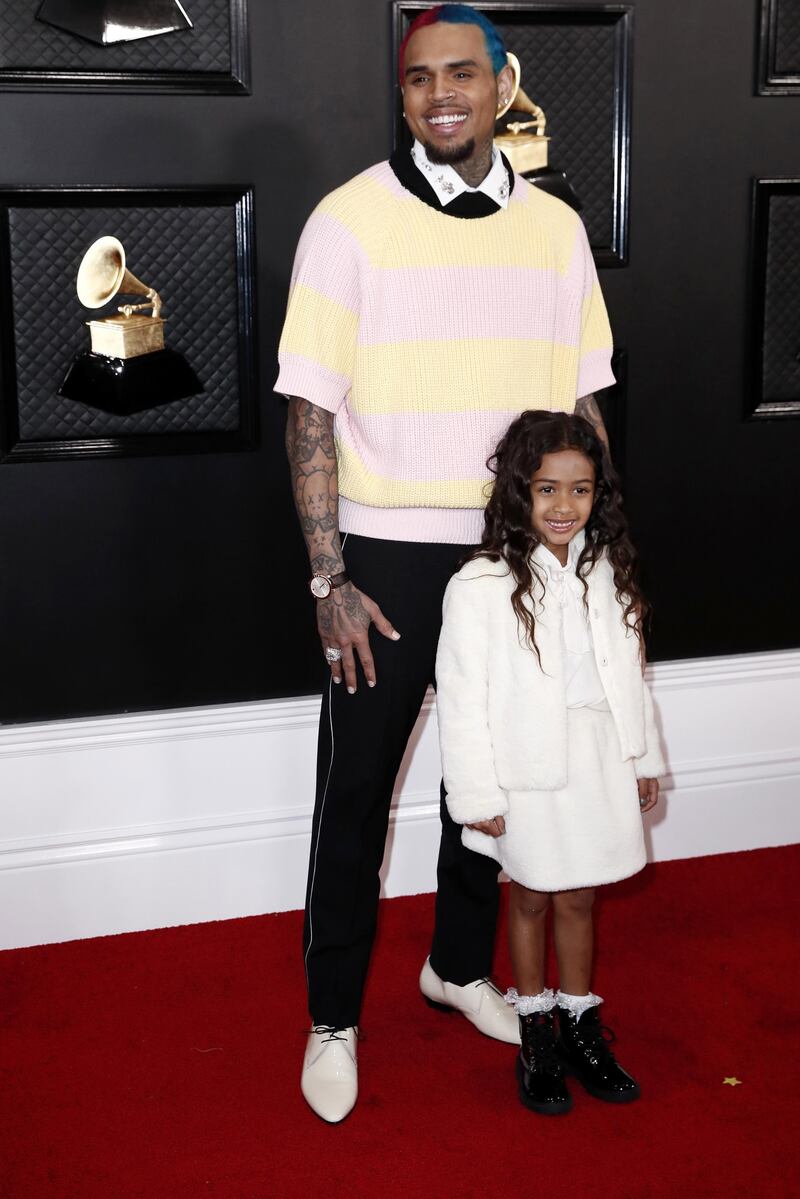 Singer Chris Brown (L) and his daughter Royalty arrive for the 62nd annual Grammy Awards ceremony at the Staples Center in Los Angeles. EPA