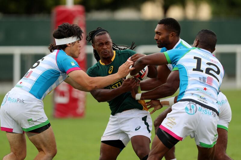 Dubai, United Arab Emirates - December 07, 2019: Branco du Preez of South Africa takes on the Speranza defence in the game between South Africa 7s Academy and Speranza 22 in the Int Invitational at the HSBC rugby sevens series 2020. Saturday, December 7th, 2019. The Sevens, Dubai. Chris Whiteoak / The National