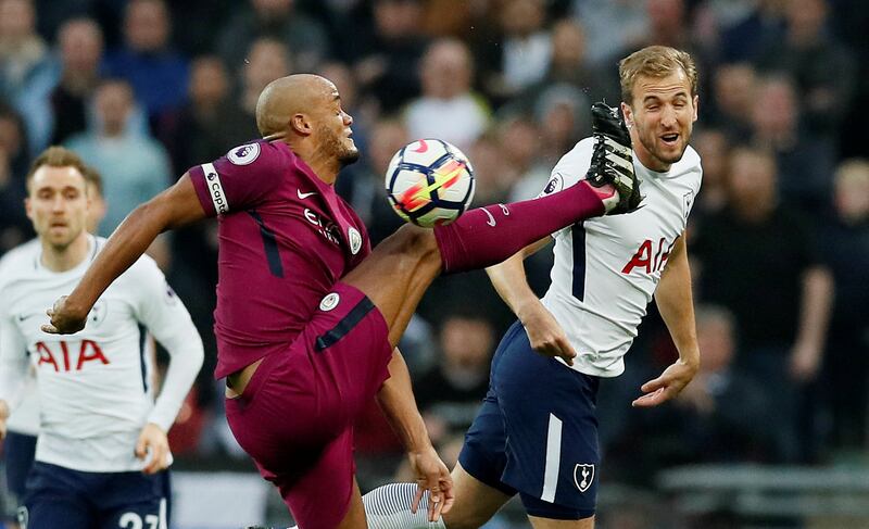 Manchester City's Vincent Kompany in action with Tottenham's Harry Kane. David Klein / Reuters