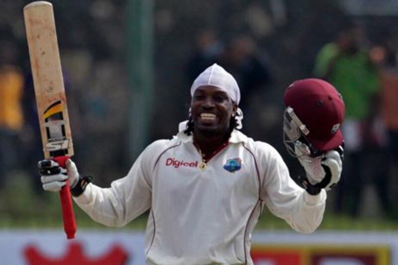 West Indies batsman Chris Gayle celebrates after scoring a triple century during the second day's play of the first test cricket match between Sri Lanka and West Indies in Galle, Sri Lanka, Tuesday, Nov. 16, 2010.(AP Photo/ Eranga Jayawardena)