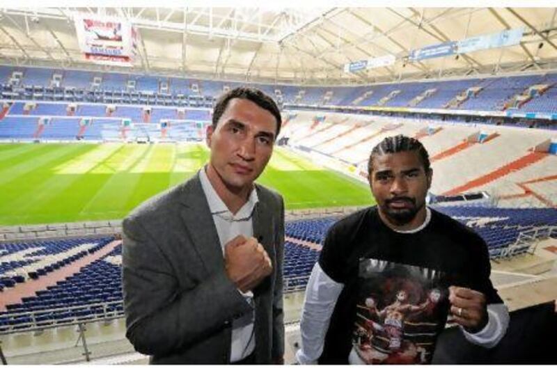 Klitschko, left, and Haye poses for photographers during a press conference. Clemens Bilan / AFP