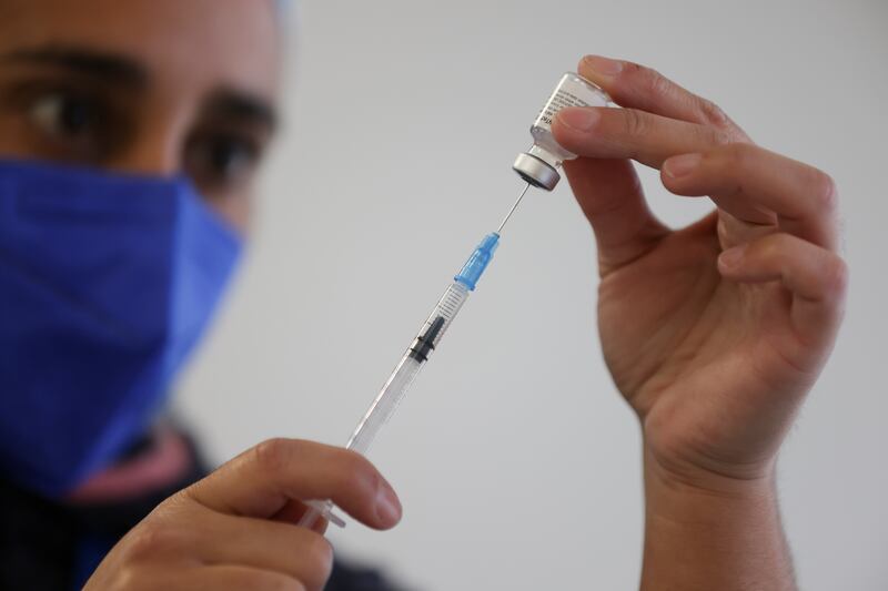 A dose of the Pfizer/BioNTech coronavirus vaccine being prepared during a vaccination campaign at the University of Santiago, Chile.