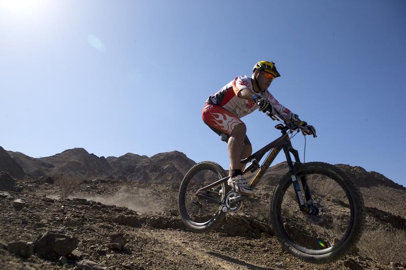 Andy Whitaker, of the Hot-Cog Mountain Bike Club, tries out the new trails in Hatta. Photos by Christopher Pike / The National