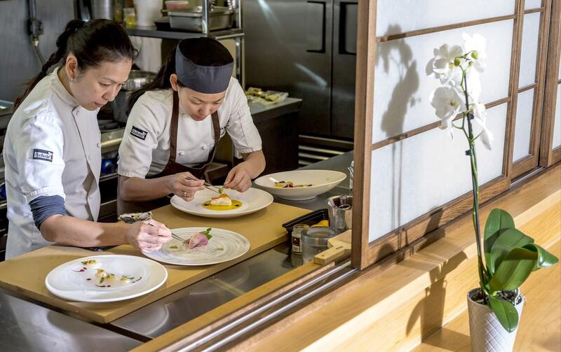 Chef Niki Nakayama, left, and assistant chef Carole Lida plate kaiseki meals, which are based on a 13th-century Japanese tradition. AP Photo