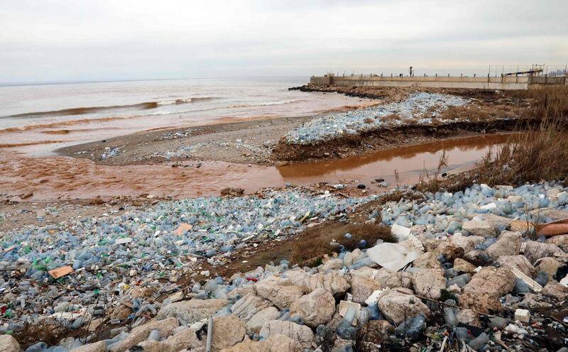 (FILES) In this file photo taken on January 14, 2017 plastic bottles litter the Ghadir River bed as it pours into the Mediterranean Sea near Beirut's International Airport.
Researchers in the US and Britain have accidentally engineered an enzyme which eats plastic and may eventually help solve the growing problem of plastic pollution, a study said on April 17, 2018. More than eight million tons of plastic are dumped into the world's oceans every year, and concern is mounting over this petroleum-derived product's toxic legacy on human health and the environment.
 / AFP PHOTO / ANWAR AMRO