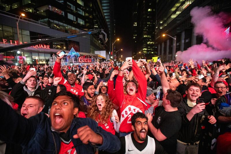 Fans react at Jurassic Park as the Toronto Raptors advance to the NBA finals after defeating the Milwaukee Bucks in game six of the NBA Eastern Conference finals. Reuters