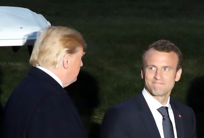 US President Donald Trump (L) confers with French President Emmanuel Macron (R) following a dinner at Mount Vernon, the estate of the first US President George Washington, in Mount Vernon, Virginia, April 23, 2018. Ludovic Marin / AFP