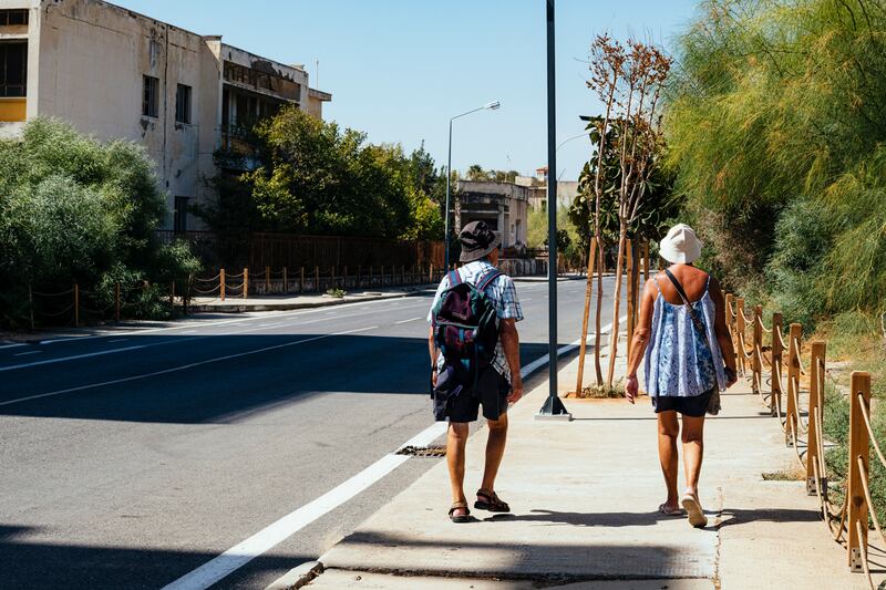 Tourists walk through Varosha. The Turkish-Cypriot administration reopened a sliver of the town this year, with plans for a wider demilitarisation of the area