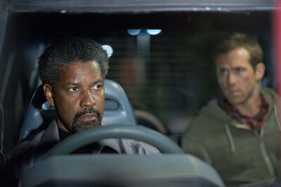 Washington and Ryan Reynolds in throwback action movie Safe House. Universal Pictures