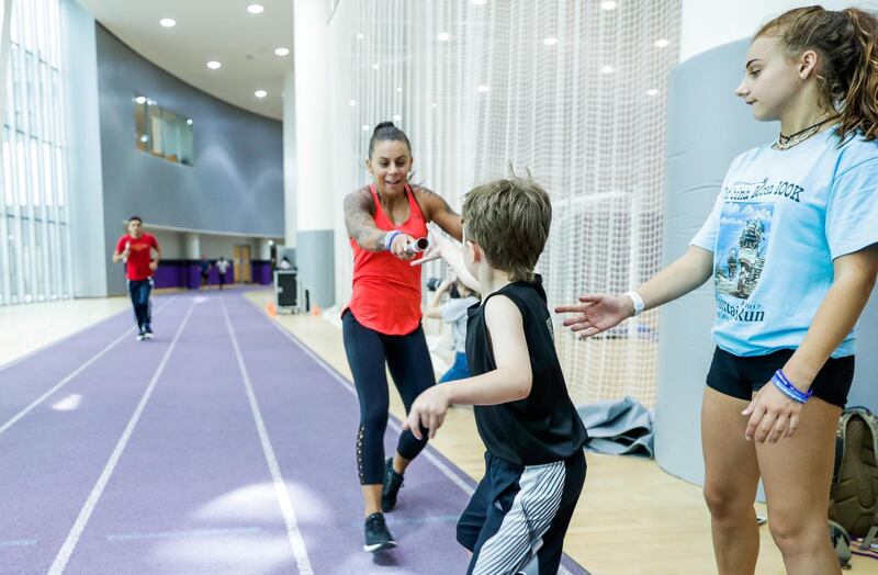 Abu Dhabi, United Arab Emirates, June 20, 2019.  Refugee day relay at NYUAD 
One of the participants has set his personal goal for the relay race at 40-50kms. He will be running from 7am-10am and then again in the afternoon from 4pm onwards.  --  (L-R)  Eva Clarke with her kids, Harley and Isabella.
Victor Besa/The National
Section:  NA
Reporter:  Haneen Dajani