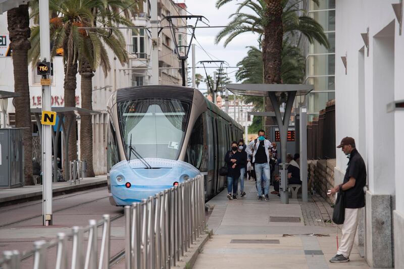 Commuters at the tram station wear mandatory face masks to prevent the spread of the coronavirus, in Rabat, Morocco. EPA