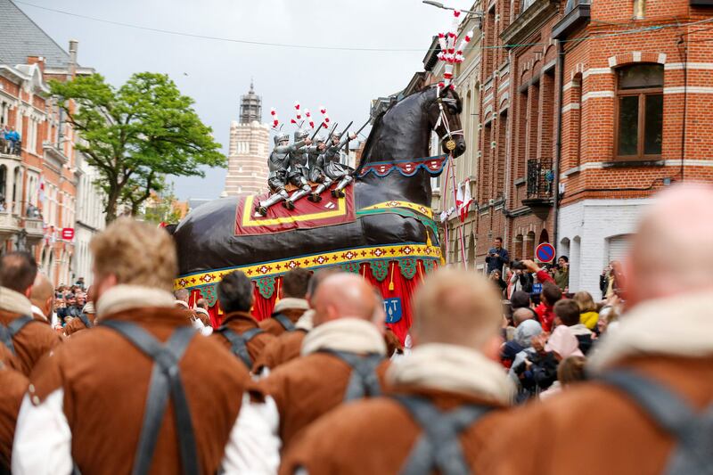 The "Ros Beiaardommegang" procession, featuring a heroic horse from folklore, in Dendermonde, Belgium. The parade should have taken place in 2020 but was postponed twice because of the Covid-19 pandemic.  AFP