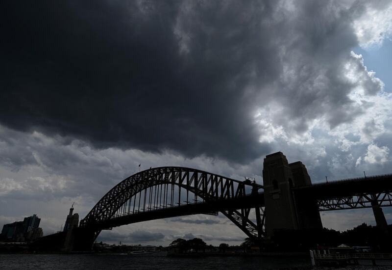 Storm clouds hang above the Sydney Harbour Bridge in Sydney, Australia.  EPA