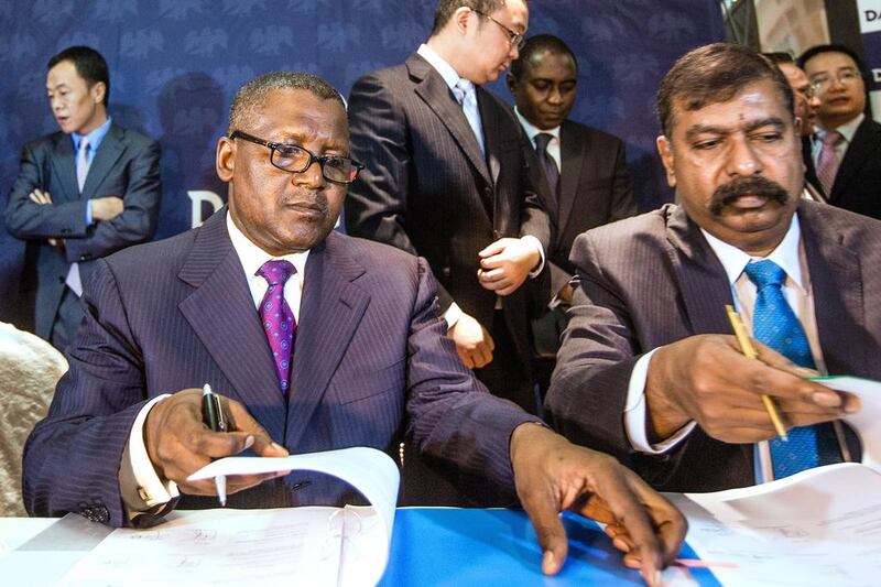 Africa’s richest man, Aliko Dangote, left, has a net worth of about US$18 billion, according to Forbes. Tom Saater / Bloomberg