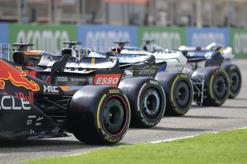 The cars are parked on the starting grid during the first day of testing at the Bahrain International Circuit. AFP