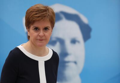 Scotland's First Minister Nicola Sturgeon speaks during her visit to the field hospital the NHS Louisa Jordan, set up at the SEC in Glasgow, Scotland on July 27, 2020, where she learned about how the venue, first setup to treat COVID-19 patients, is being adapted for to treat outpatients. / AFP / POOL / Andrew Milligan
