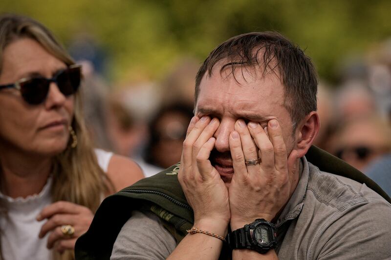 A man overcome with emotion in Hyde Park. AP