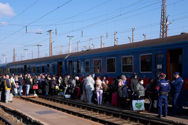 People board a train to return to Ukraine after getting supplies in Zahony, Hungary.  AP Photo
