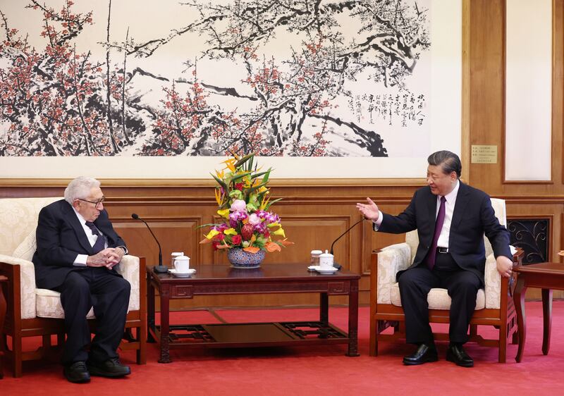 Former US secretary of state Henry Kissinger and Chinese President Xi Jinping at the Diaoyutai State Guesthouse in Beijing. Reuters