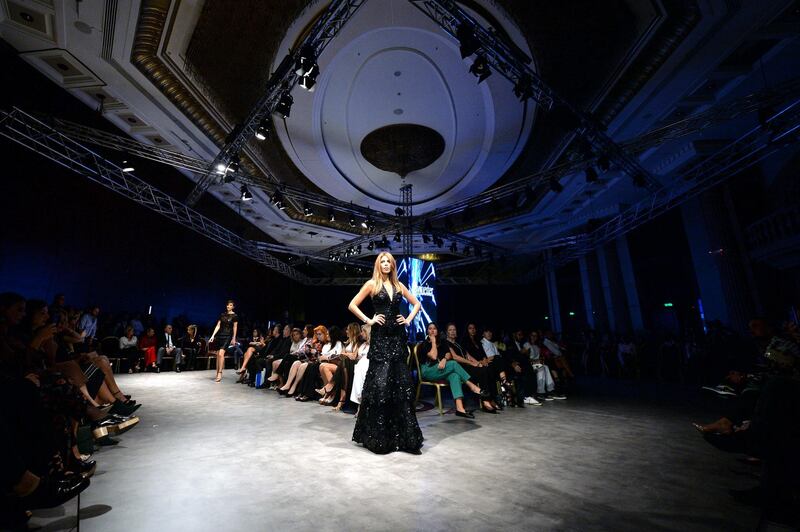 A model presents an Haute Couture creation by Lebanese designer Georges Choueiter during a Fashion show in Beirut. EPA