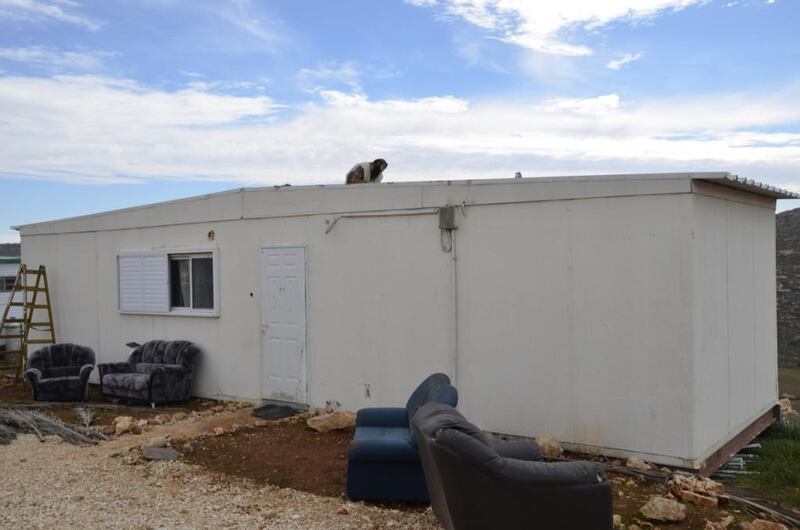 Prefabricated houses such as these are where the newest residents of Esh Kodesh live when they first arrive at the Israeli outpost. Kate Shuttleworth for The National