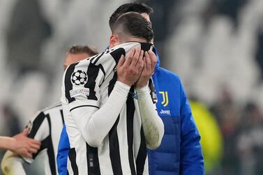 Juventus' Mattia De Sciglio covers his face at the end of the Champions League, round of 16, second leg soccer match between Juventus and Villarreal at the Allianz stadium in Turin, Italy, Wednesday, March 16, 2022.  Villareal won 3-0.  (AP Photo / Antonio Calanni)