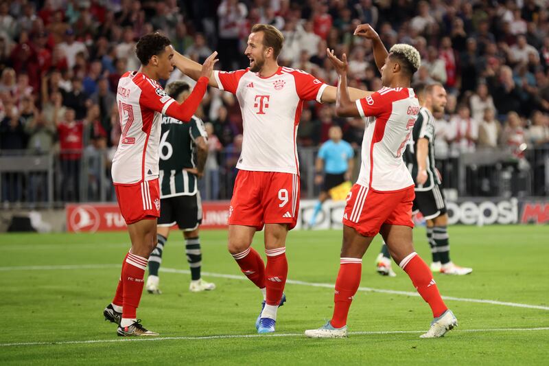 Harry Kane celebrates with Bayern Munich goalscorer Serge Gnabry, right, and Jamal Musiala after the second goal. Getty 