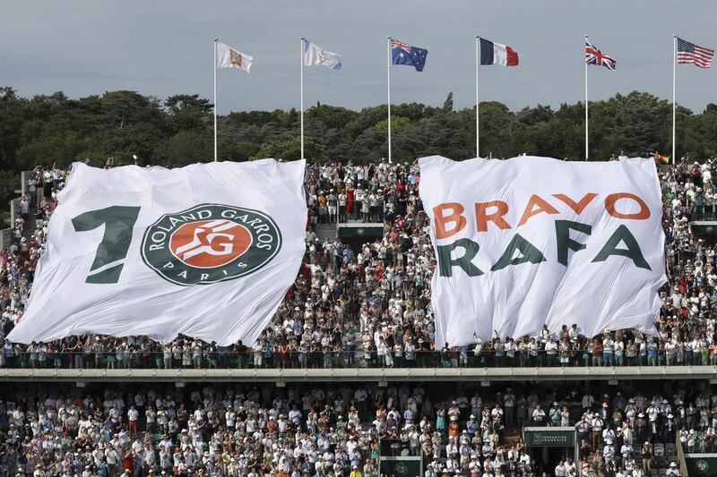 Banners are displayed congratulating Rafael Nadal. AP Photo