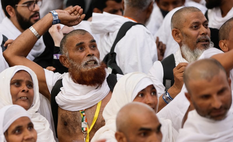 Pilgrims cast their stones. Reuters