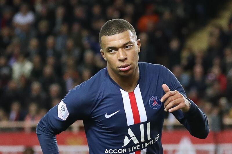 Paris Saint-Germain's French forward Kylian Mbappe celebrates after scoring a goal  during the French L1 football match between Monaco (ASM) and Paris Saint-Germain (PSG) at the Louis II Stadium in Monaco on January 15, 2020. / AFP / Valery HACHE
