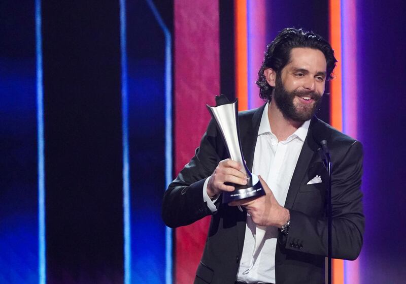 Male Artist of the Year winner Thomas Rhett celebrates with his award at the 56th Academy of Country Music Awards at the Grand Ole Opry in Nashville. Reuters