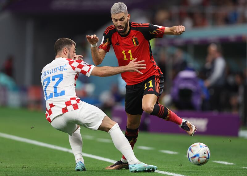 Josip Juranovic, left, of Croatia battles for possession with Yannick Carrasco of Belgium. EPA