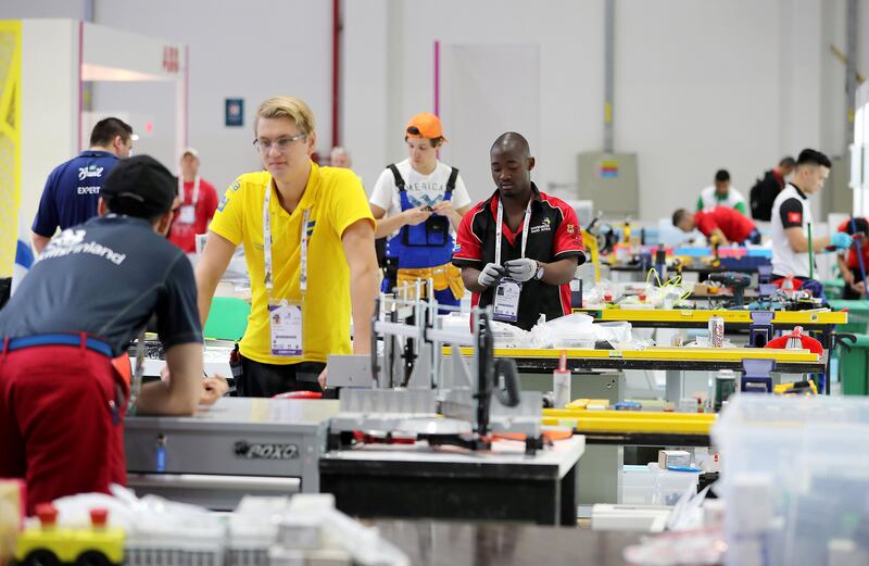 ABU DHABI , UNITED ARAB EMIRATES , OCT 14   – 2017 :- Member of different teams at the ABB , Electrical Installations stand preparing for the WorldSkills Abu Dhabi 2017 held at ADNEC in Abu Dhabi.  (Pawan Singh / The National) Story by Roberta