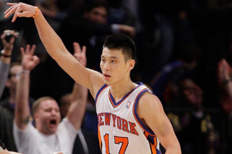FILE - In this Feb. 10, 2012, file photo, New York Knicks' Jeremy Lin reacts after making a 3-point basket during the second half of an NBA basketball game against the Los Angeles Lakers in New York. Lin will visit the Houston Rockets on Wednesday, June 4, 2012, two people with knowledge of the plans said, and the Knicks restricted free agent is expected to get a contract offer. The Rockets waived Lin last December and he was claimed by the Knicks, turning into a breakout star when he landed the starting point guard job. Now with Goran Dragic not expected to return, Houston may want Lin back. (AP Photo/Frank Franklin II, File)