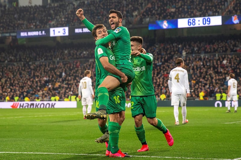 Real Sociedad midfielder Mikel Merino, centre, celebrates with his teammates after scoring during their Copa del Rey quarter-final win against Real Madrid at the Santiago Bernabeu Stadium in February 2020. EPA