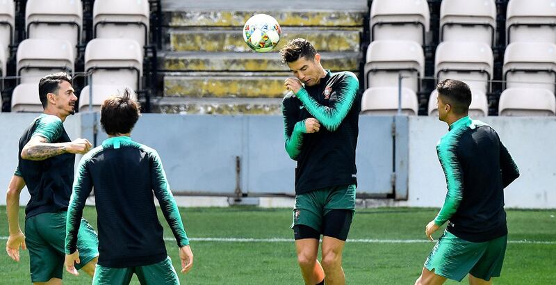 Portugal's Cristiano Ronaldo heads the ball during a training session at the Bessa stadium in Porto. AP Photo